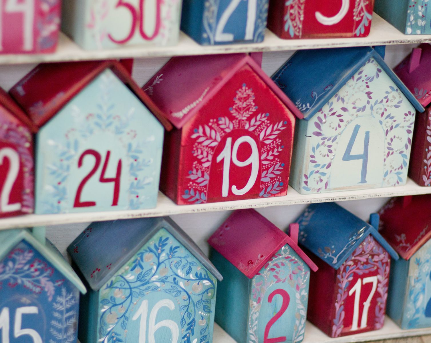 Festive Ceramic Houses with Advent Numbers Painted on them